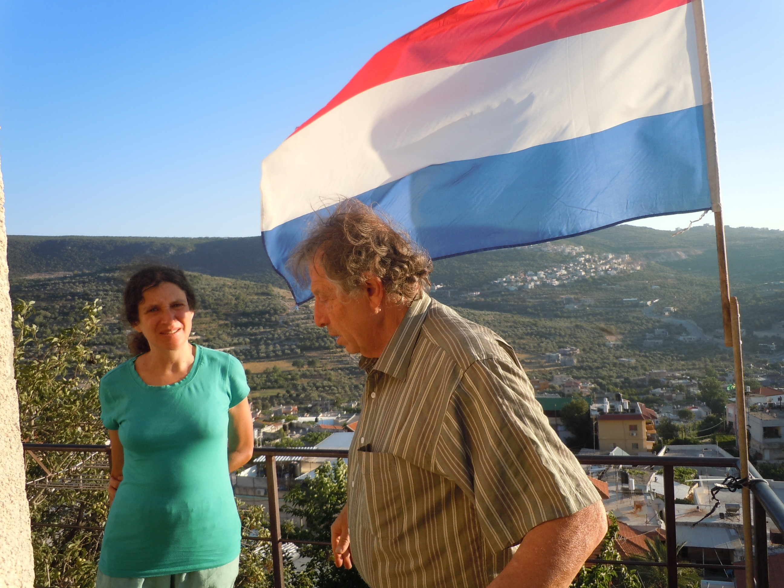 Dina with our host Abel, a Dutch immigrant, on their patio overlooking the Druze village of Pequ'in, Israel
