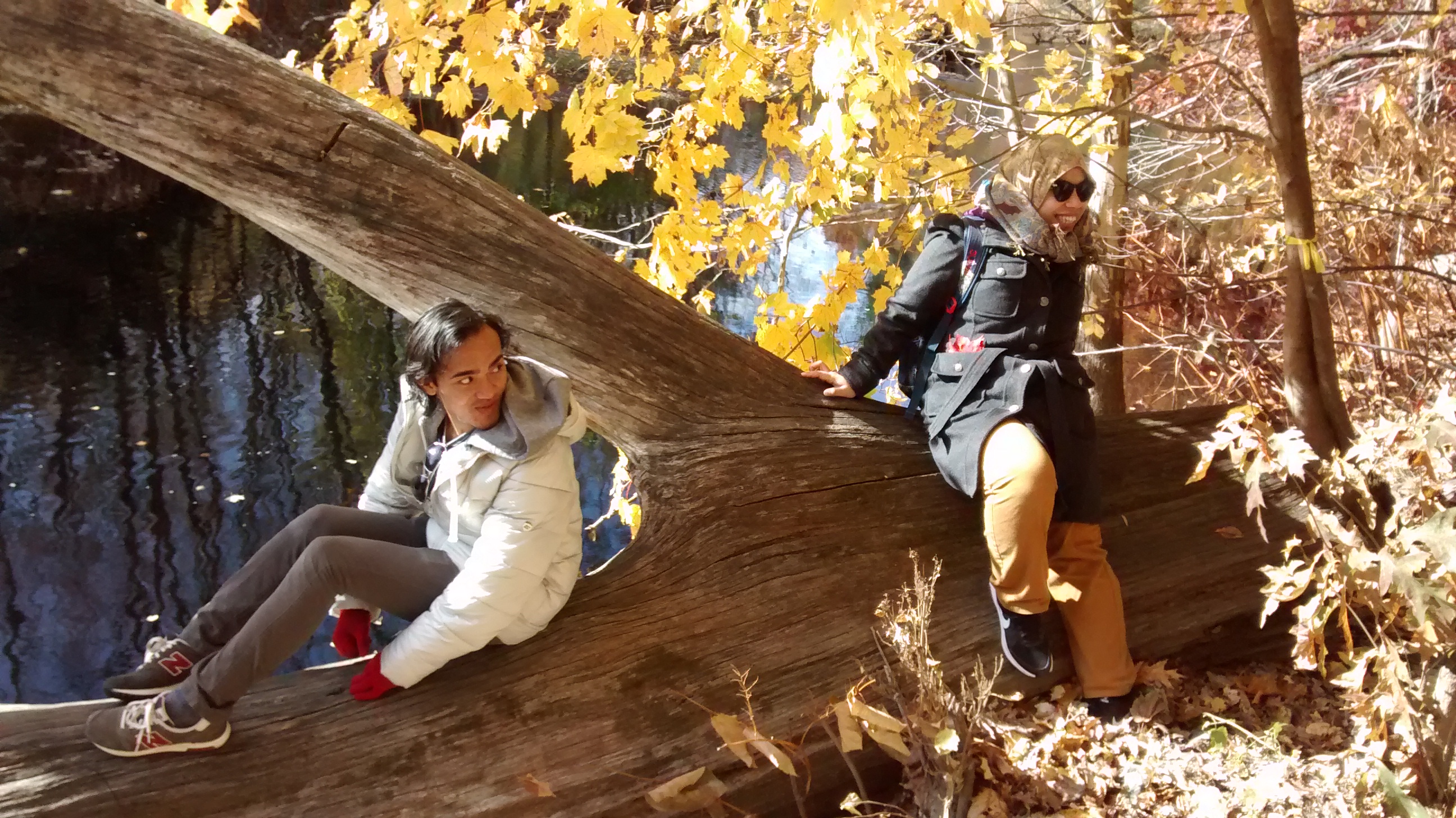Malaysian visitors Farith and Rahma hiking in the Smith College woods
