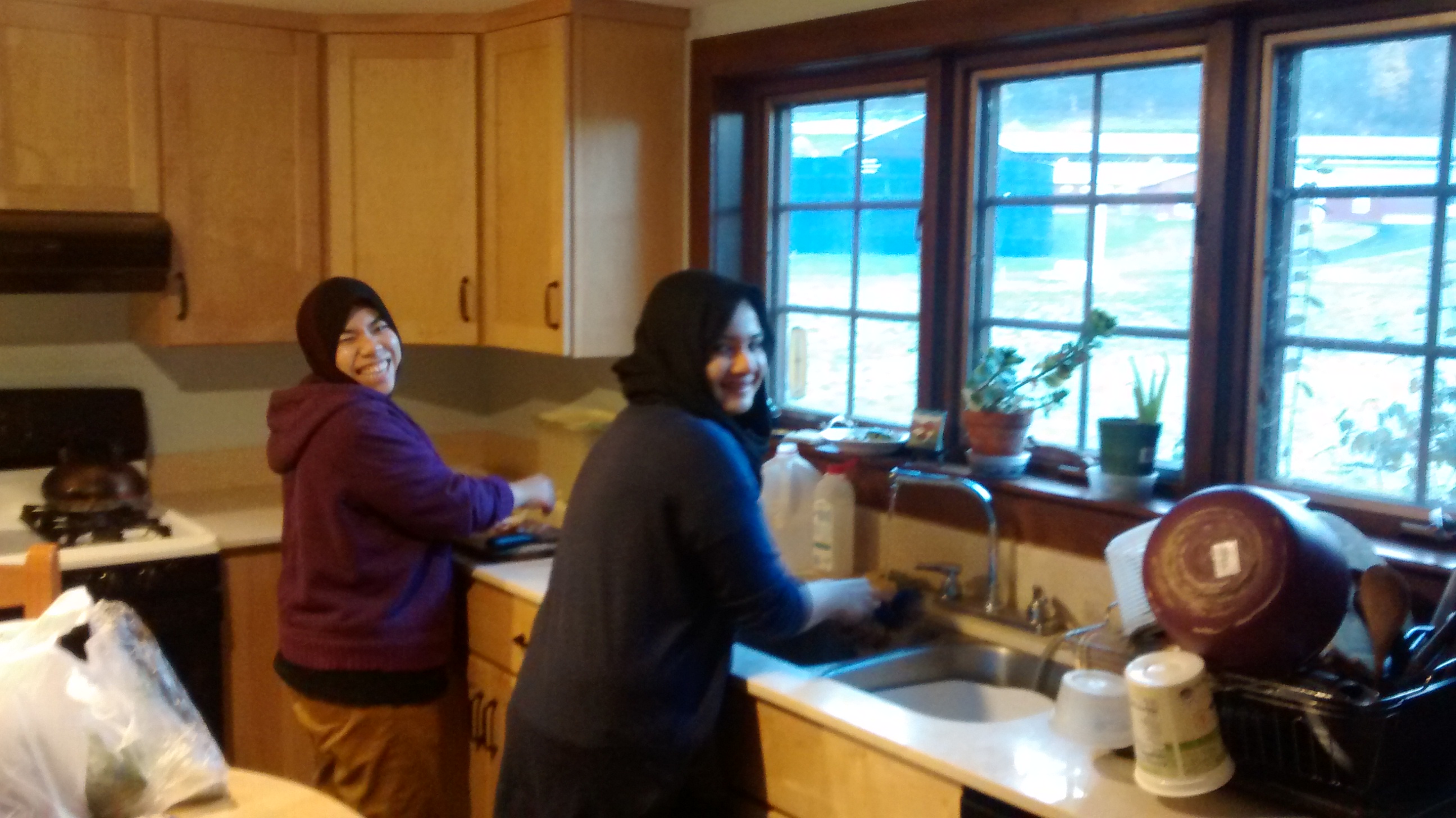 Malaysian visitors Rahma and Ain cook a feast in my kitchen