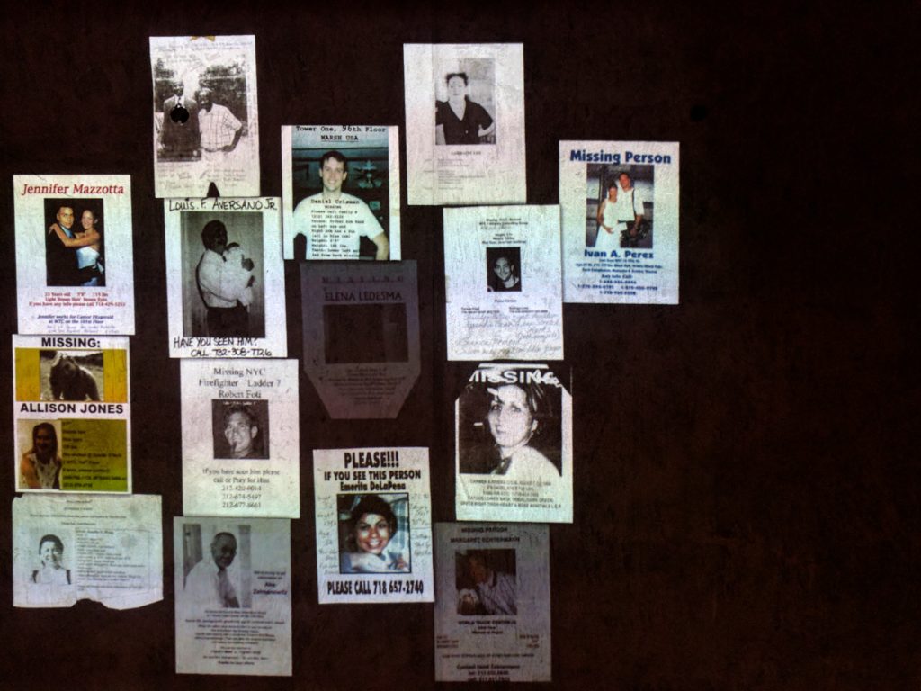 Missing-Person posters projected holographically at the 9/11 Memorial